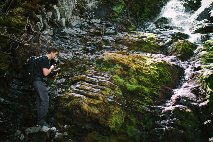 IMAGE: Photograph – Steve Seeley filming a waterfall
