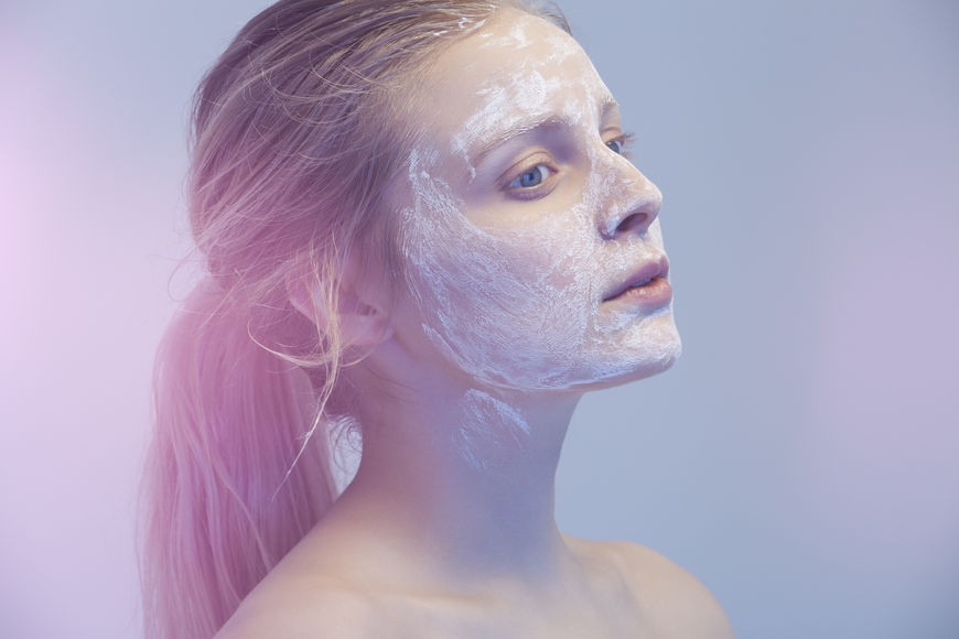 IMAGE: Photography - Blue-tinted woman with face mask